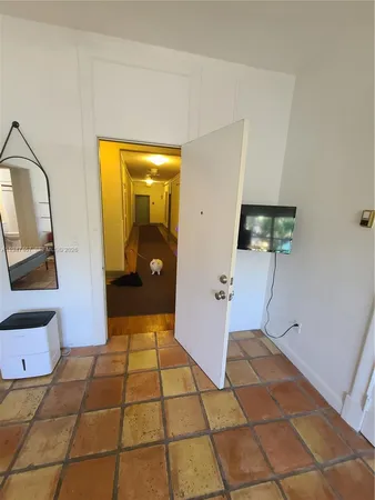 a kitchen with a sink cabinets and window