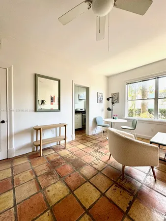 a kitchen with granite countertop a stove and a sink