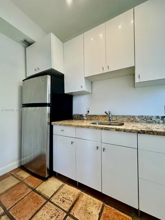 a view of a backyard with sitting area