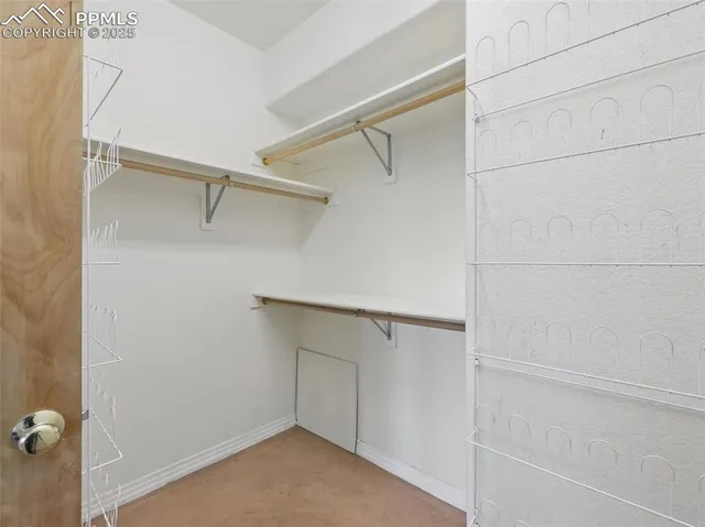 a view of an empty walk in closet