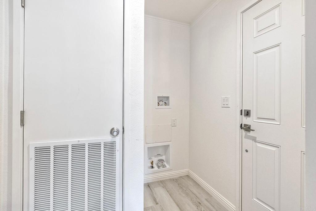 28890 Lilac Road Valley Center, CA 92082 - Photo 20 of 57 a view of a hallway with closet and wooden floor