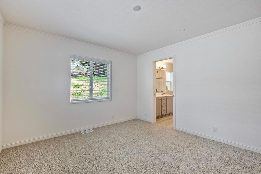 28890 Lilac Road Valley Center, CA 92082 - Photo 27 of 57 an empty room with windows and closet