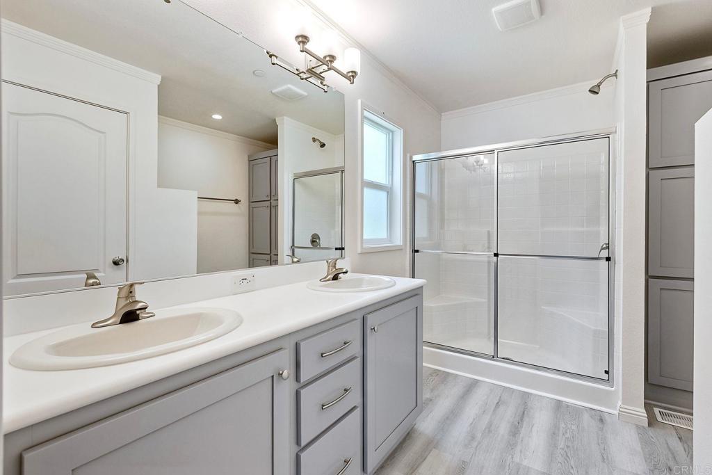 28890 Lilac Road Valley Center, CA 92082 - Photo 29 of 57 a bathroom with a sink double vanity and a mirror