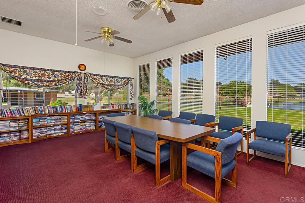 28890 Lilac Road Valley Center, CA 92082 - Photo 43 of 57 a dining room with furniture and a floor to ceiling window