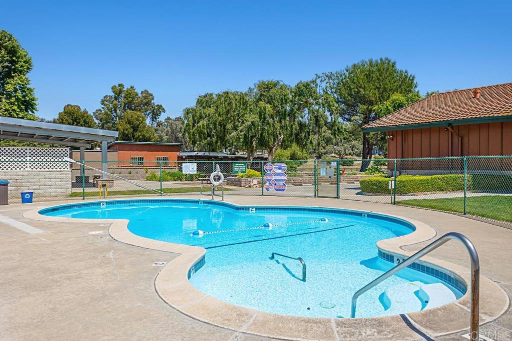 28890 Lilac Road Valley Center, CA 92082 - Photo 49 of 57 a view of a swimming pool with a lounge chairs