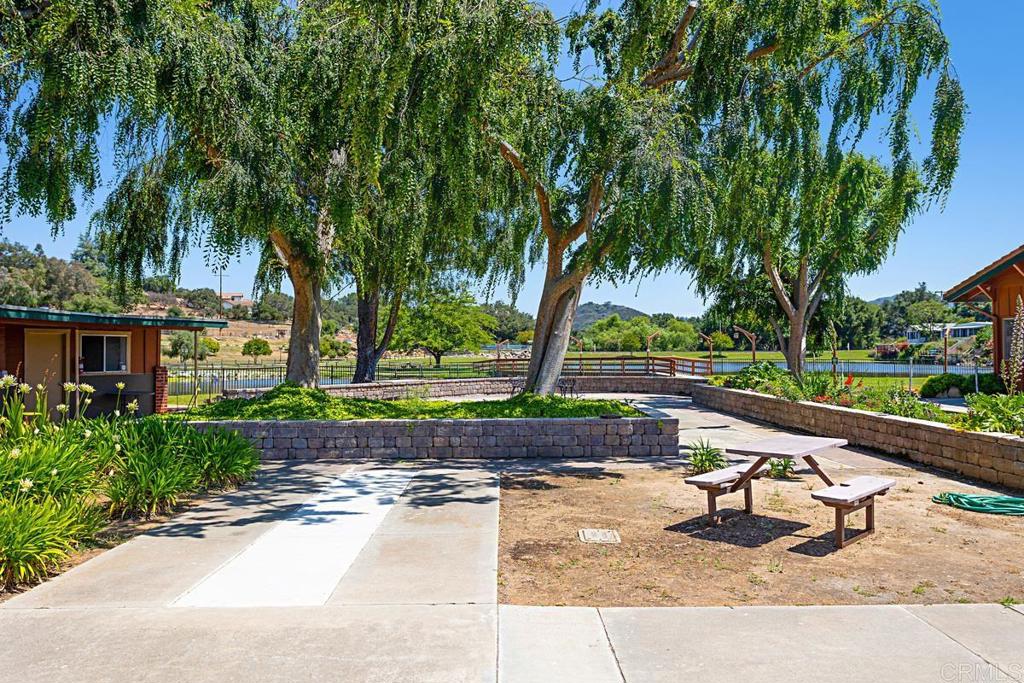 28890 Lilac Road Valley Center, CA 92082 - Photo 50 of 57 a view of a park with potted plants and large trees