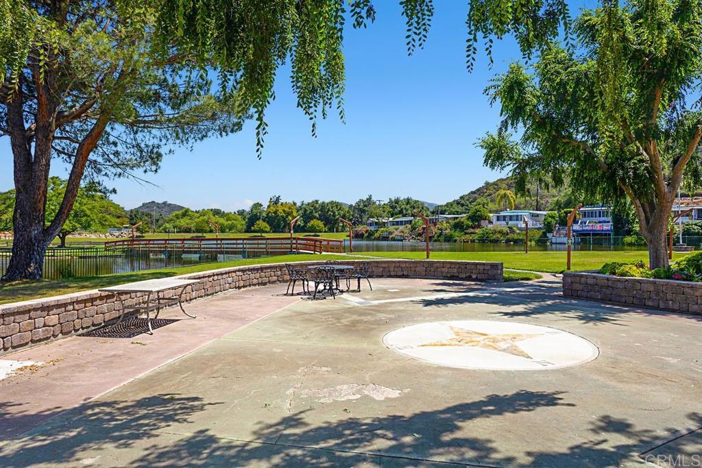 28890 Lilac Road Valley Center, CA 92082 - Photo 51 of 57 a view of a swimming pool with an outdoor space and seating area