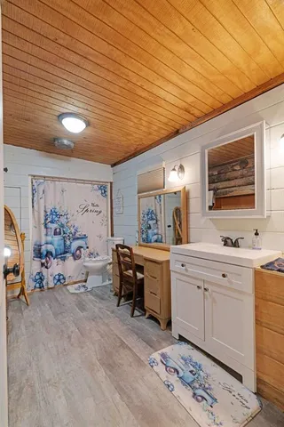 a large white kitchen with a large window
