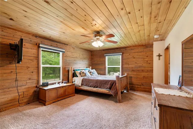 a bedroom with furniture fireplace and window