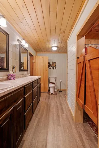a spacious bathroom with a double vanity sink and a mirror