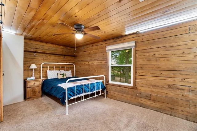 a room with a bed and window