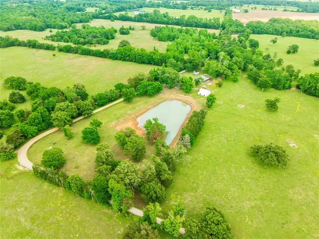 a view of a lake with a yard