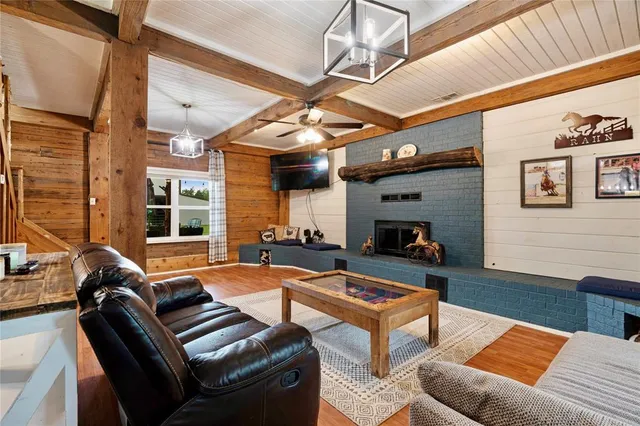 a outdoor living space with patio furniture and a fireplace