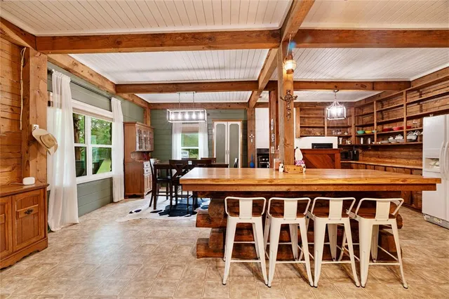 a large room with a table and chairs