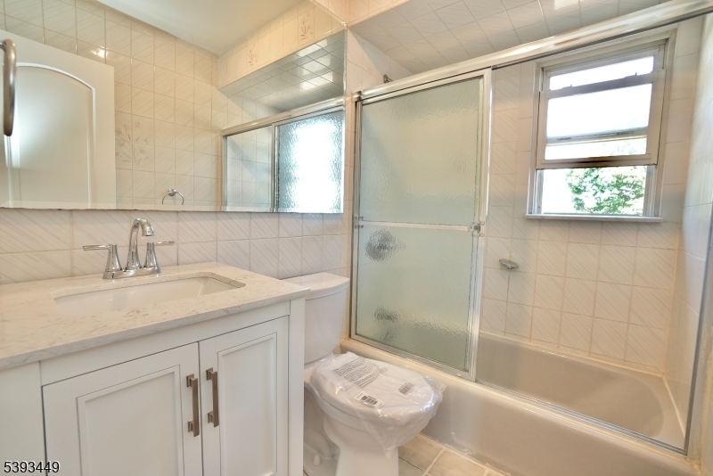 15 Wright Court, Unit 2 Bloomfield, NJ 07003 - Photo 12 of 13 a bathroom with a sink toilet and shower