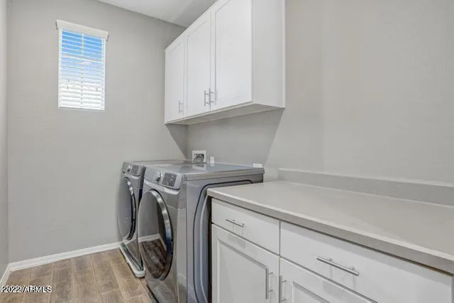 a view of a building with barbeque oven and bench