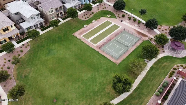 an aerial view of a house with a yard and garden