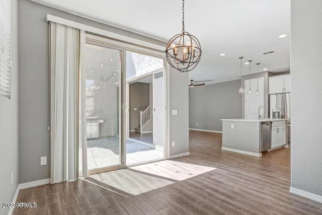 a view of an entryway of wooden floor