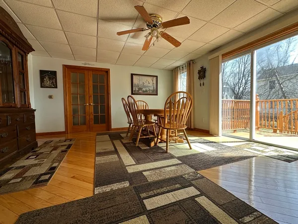 a view of a dining room with furniture window and outside view