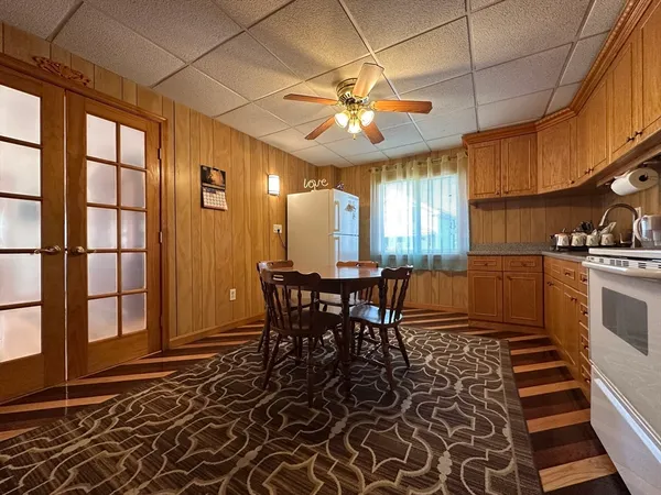 a view of a dining room with furniture and window