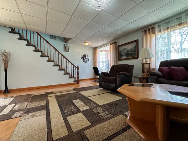 a living room with a couch and a window
