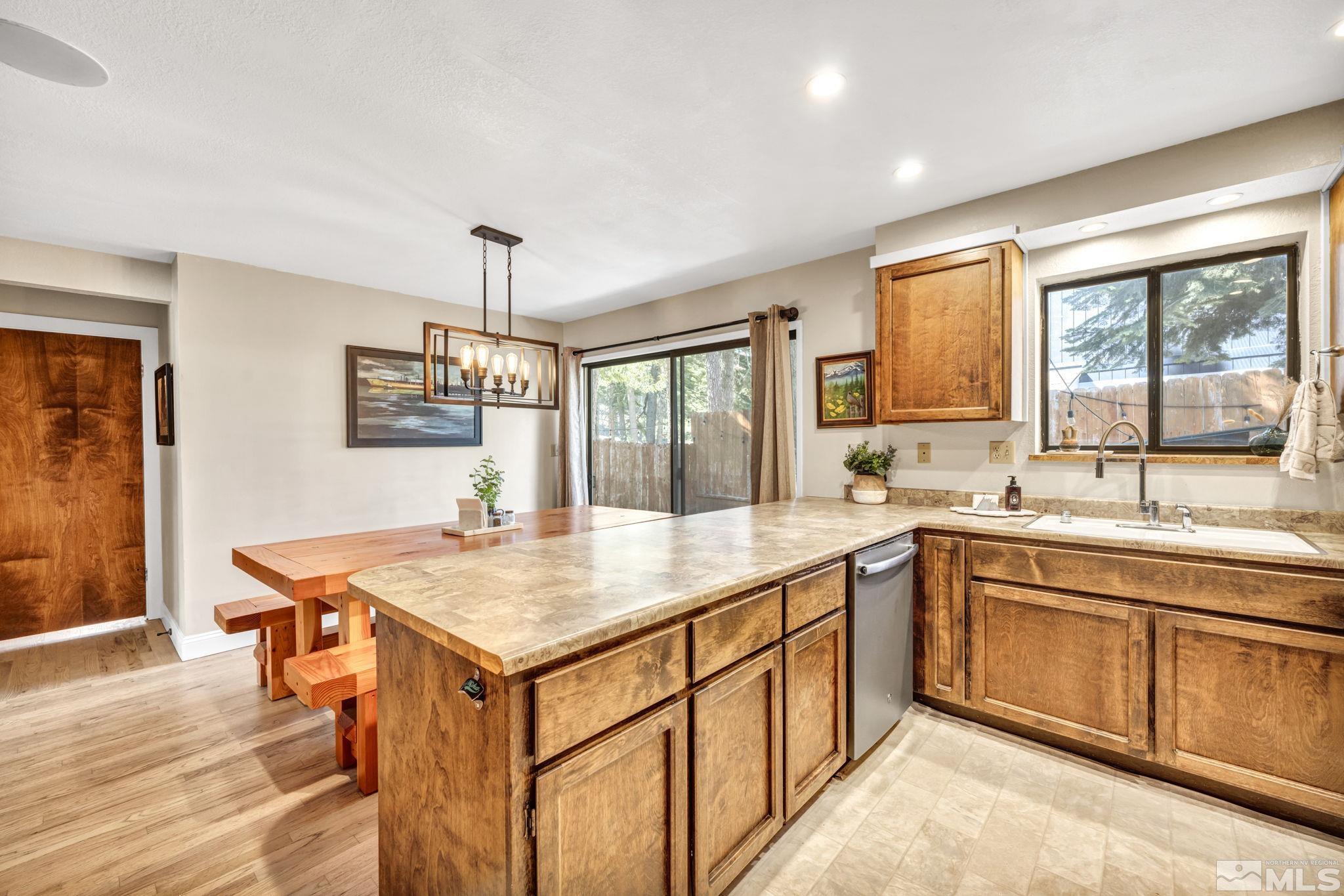 445 Andria Drive Stateline, NV 89449 - Photo 14 of 36 a kitchen with a stove sink and cabinets