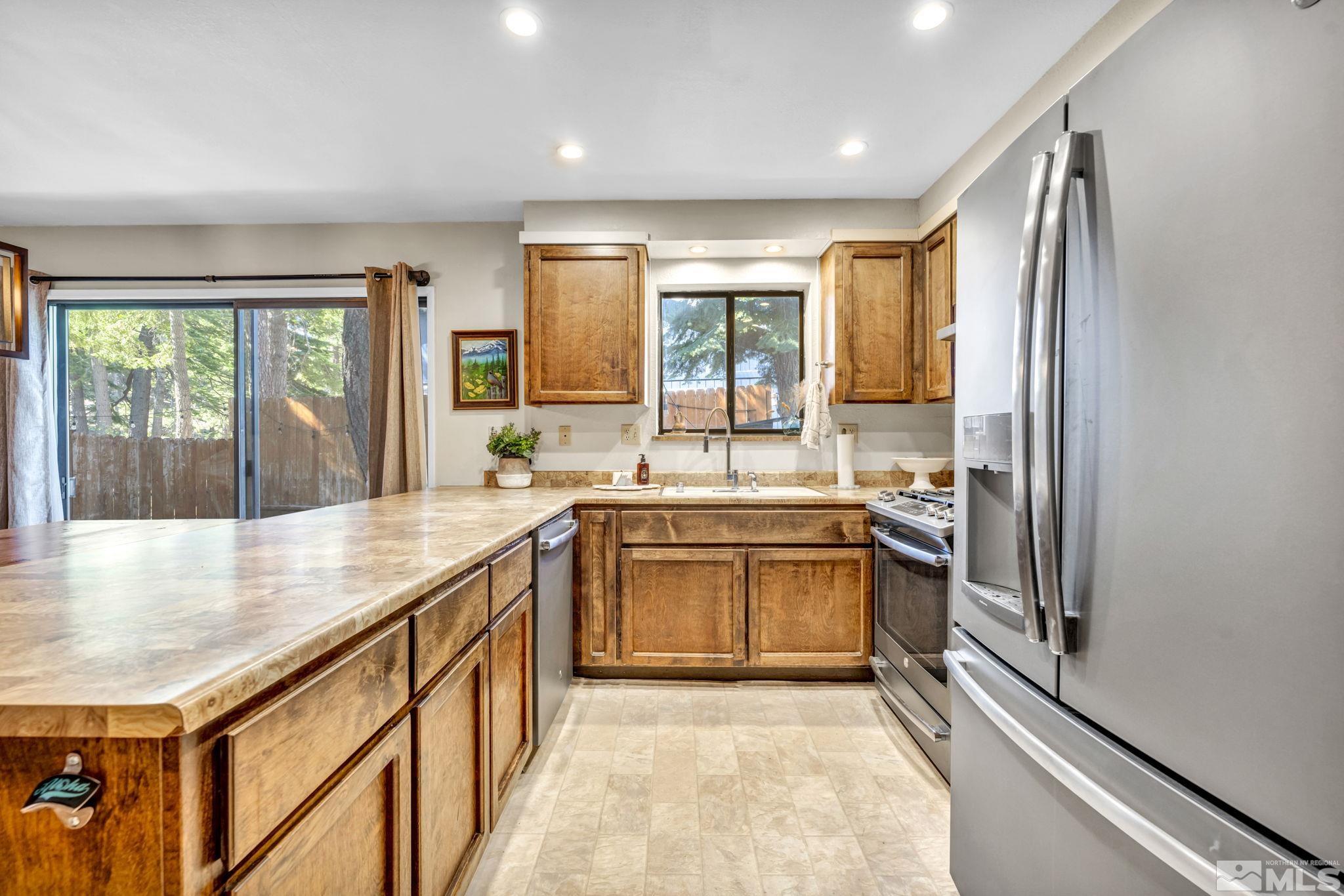 445 Andria Drive Stateline, NV 89449 - Photo 15 of 36 a kitchen with a sink stove and refrigerator