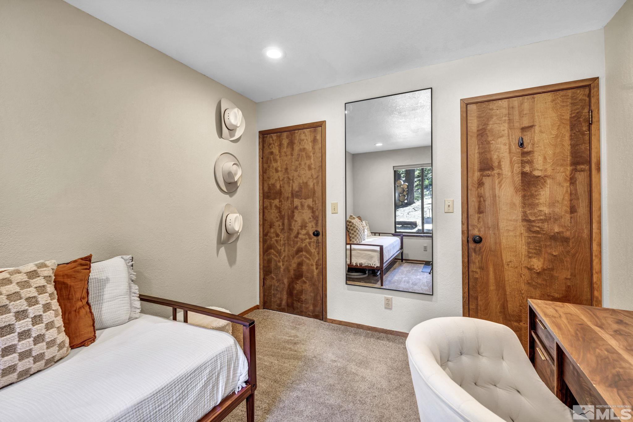 445 Andria Drive Stateline, NV 89449 - Photo 26 of 36 a bedroom with furniture and a glass door