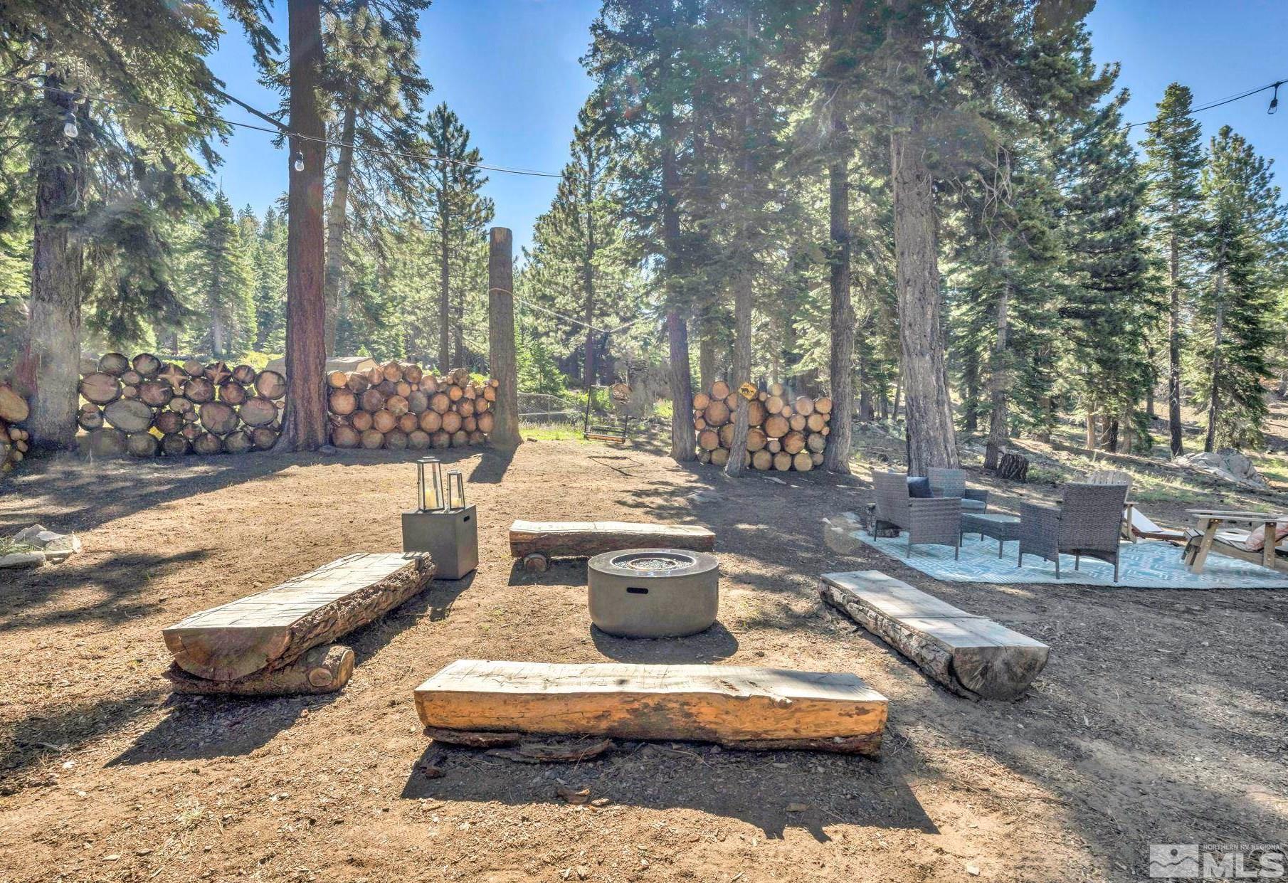445 Andria Drive Stateline, NV 89449 - Photo 4 of 36 a view of a patio with chairs and a fire pit
