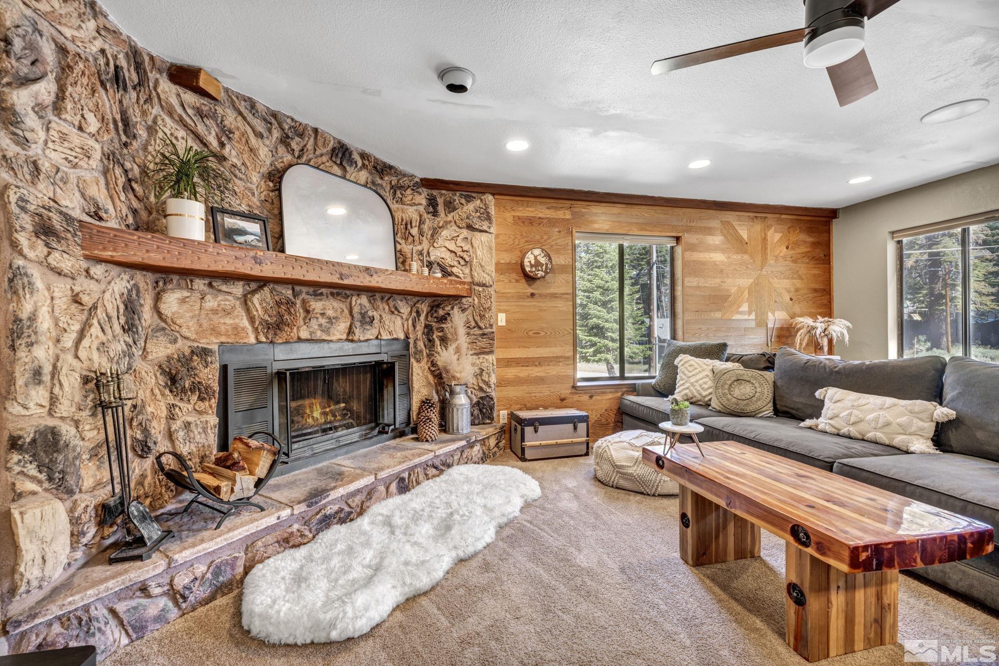 445 Andria Drive Stateline, NV 89449 - Photo 9 of 36 a living room with furniture large window and fireplace