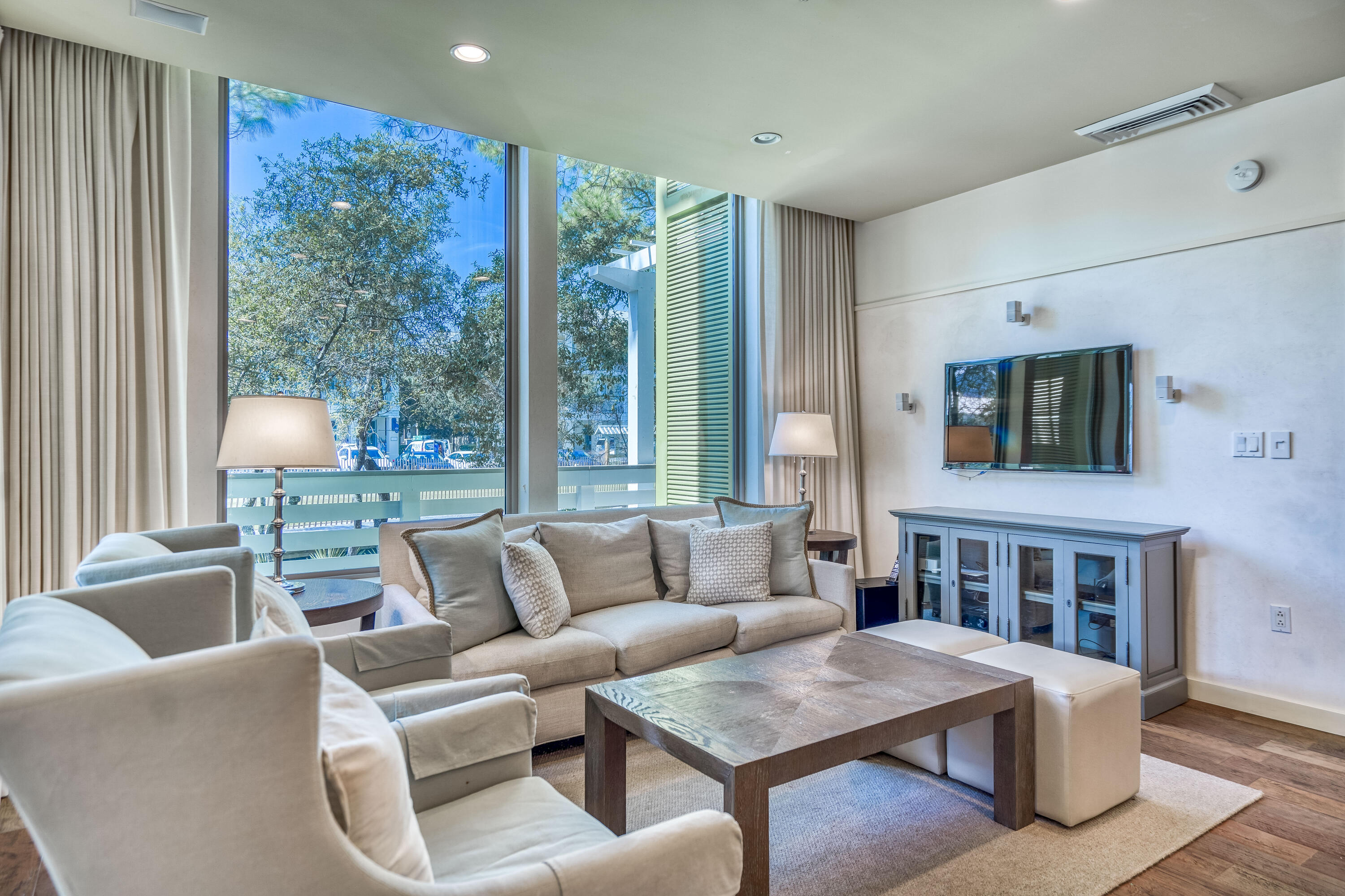 29 Goldenrod Circle, Unit 303/7 Santa Rosa Beach, FL 32459 - Photo 13 of 36 a living room with furniture and a flat screen tv
