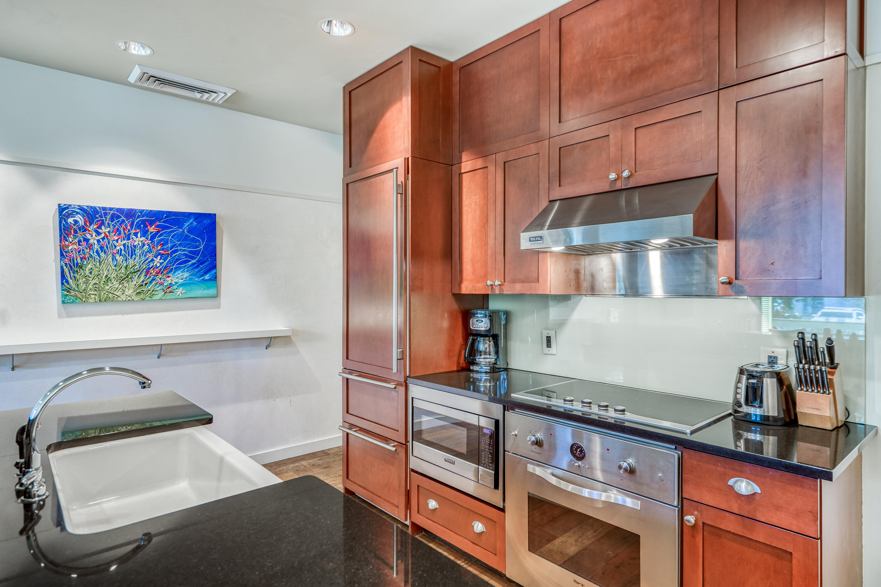 29 Goldenrod Circle, Unit 303/7 Santa Rosa Beach, FL 32459 - Photo 15 of 36 a kitchen with stainless steel appliances granite countertop a refrigerator and a stove top oven