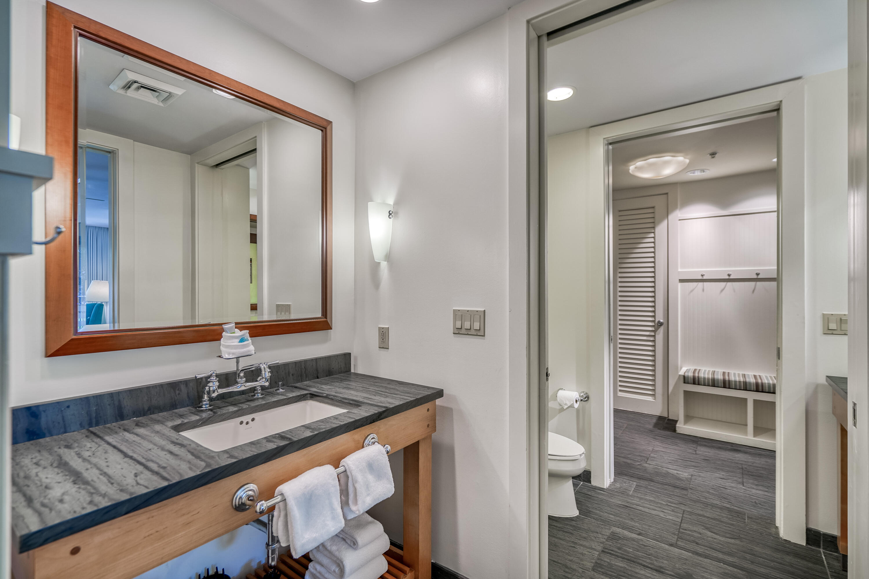 29 Goldenrod Circle, Unit 303/7 Santa Rosa Beach, FL 32459 - Photo 17 of 36 a bathroom with a granite countertop sink and a mirror