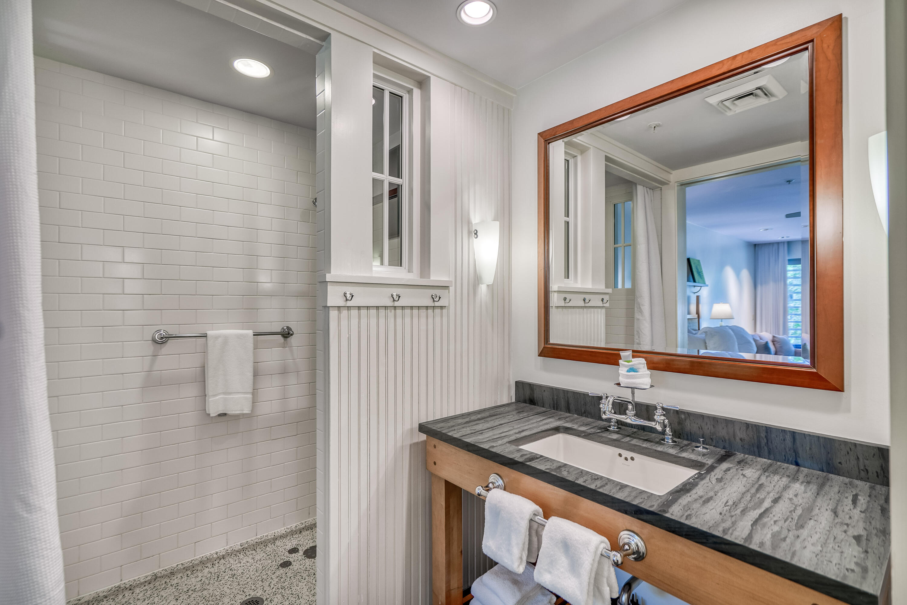 29 Goldenrod Circle, Unit 303/7 Santa Rosa Beach, FL 32459 - Photo 18 of 36 a bathroom with a granite countertop sink and a mirror