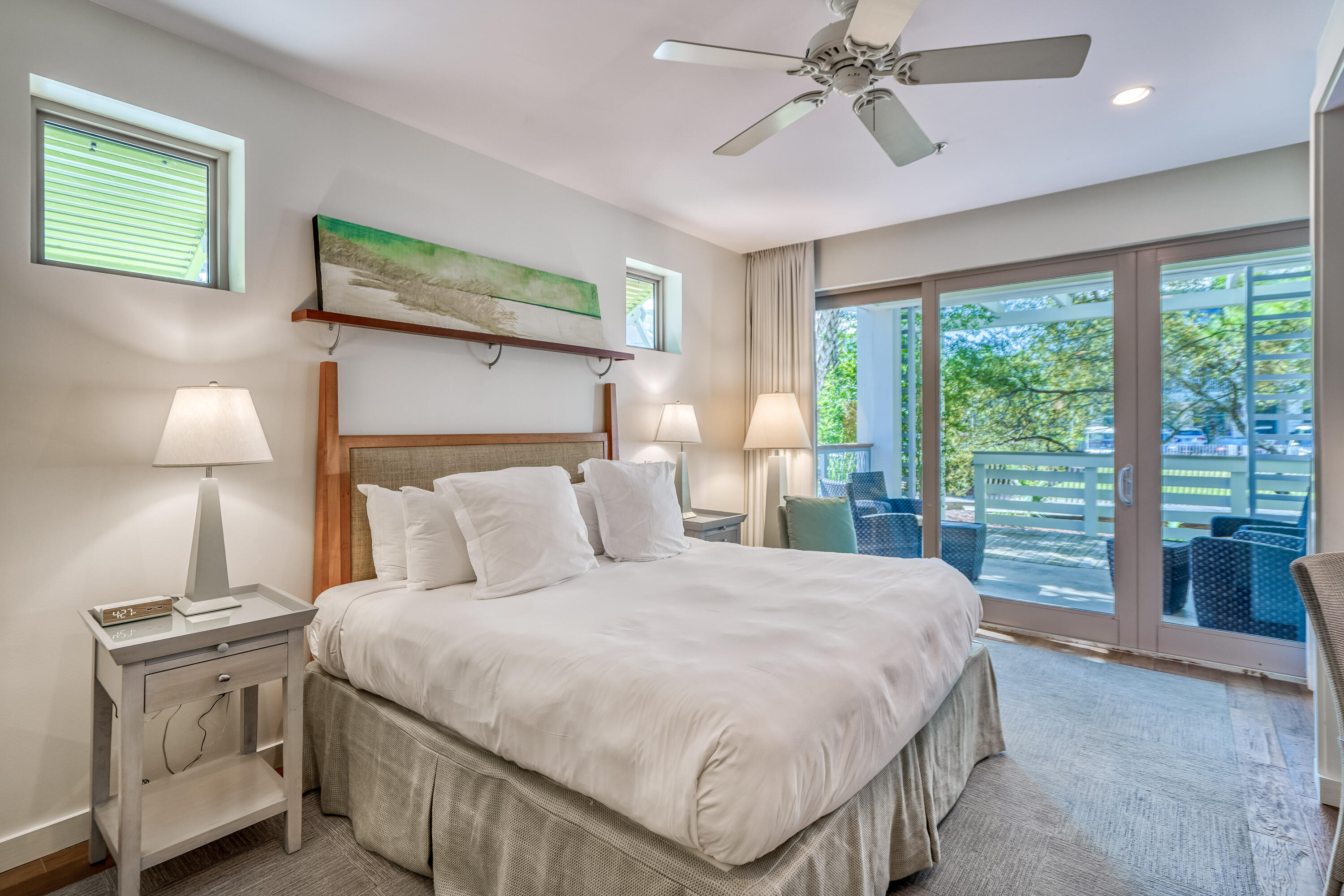 29 Goldenrod Circle, Unit 303/7 Santa Rosa Beach, FL 32459 - Photo 23 of 36 a bedroom with a large bed and a chandelier