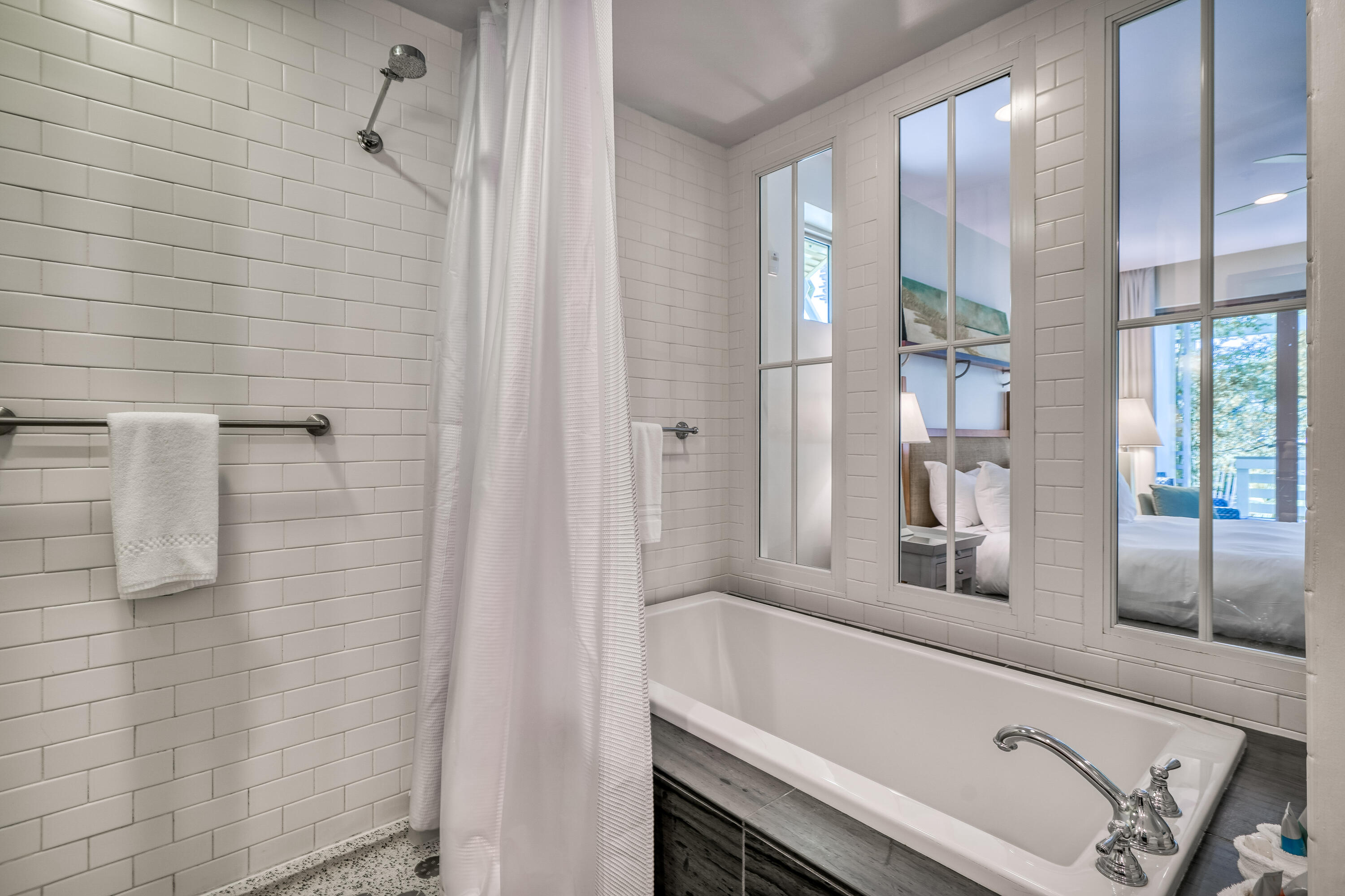 29 Goldenrod Circle, Unit 303/7 Santa Rosa Beach, FL 32459 - Photo 27 of 36 a bathroom with a bathtub and a shower
