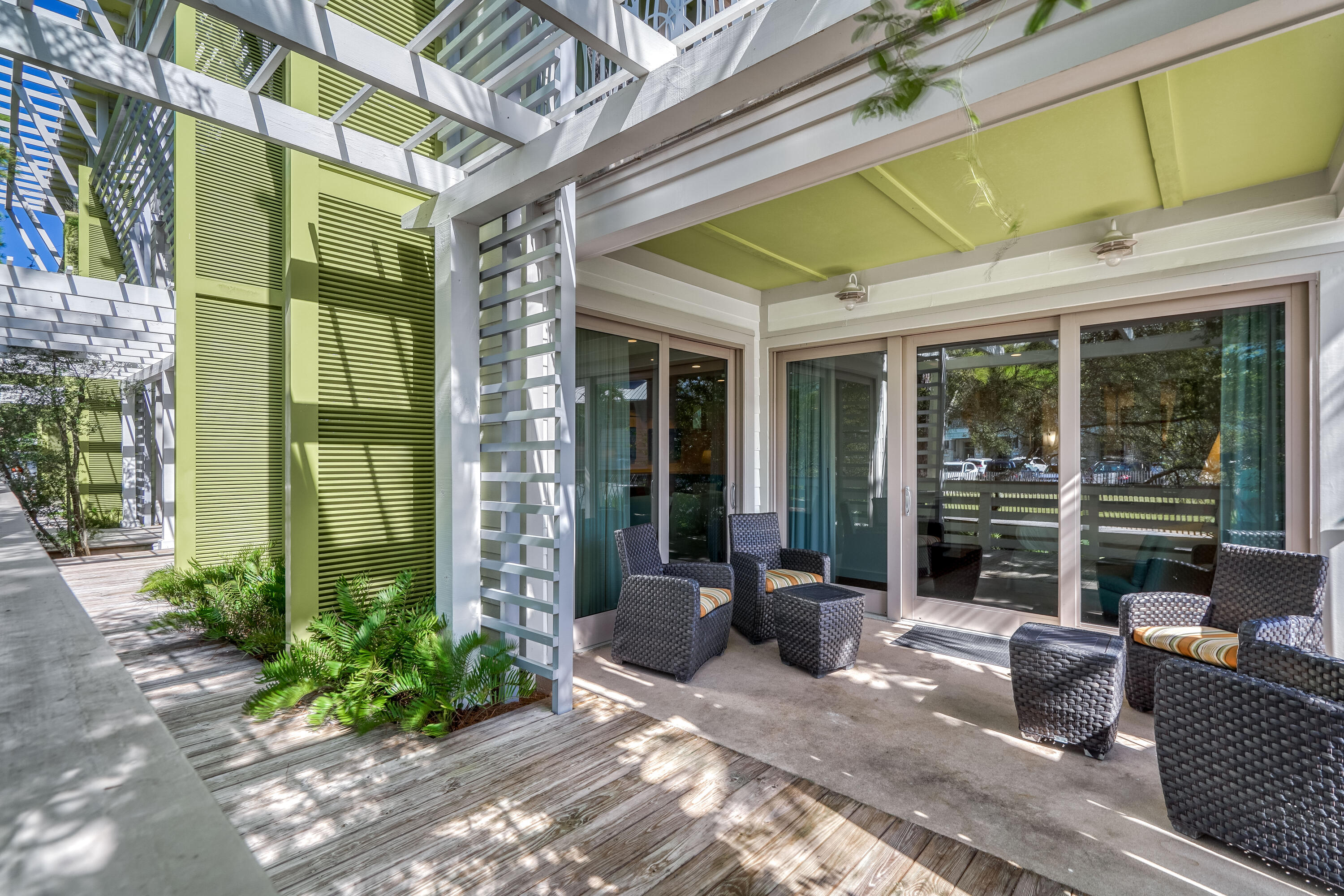 29 Goldenrod Circle, Unit 303/7 Santa Rosa Beach, FL 32459 - Photo 33 of 36 a view of a patio with table and chairs and potted plants