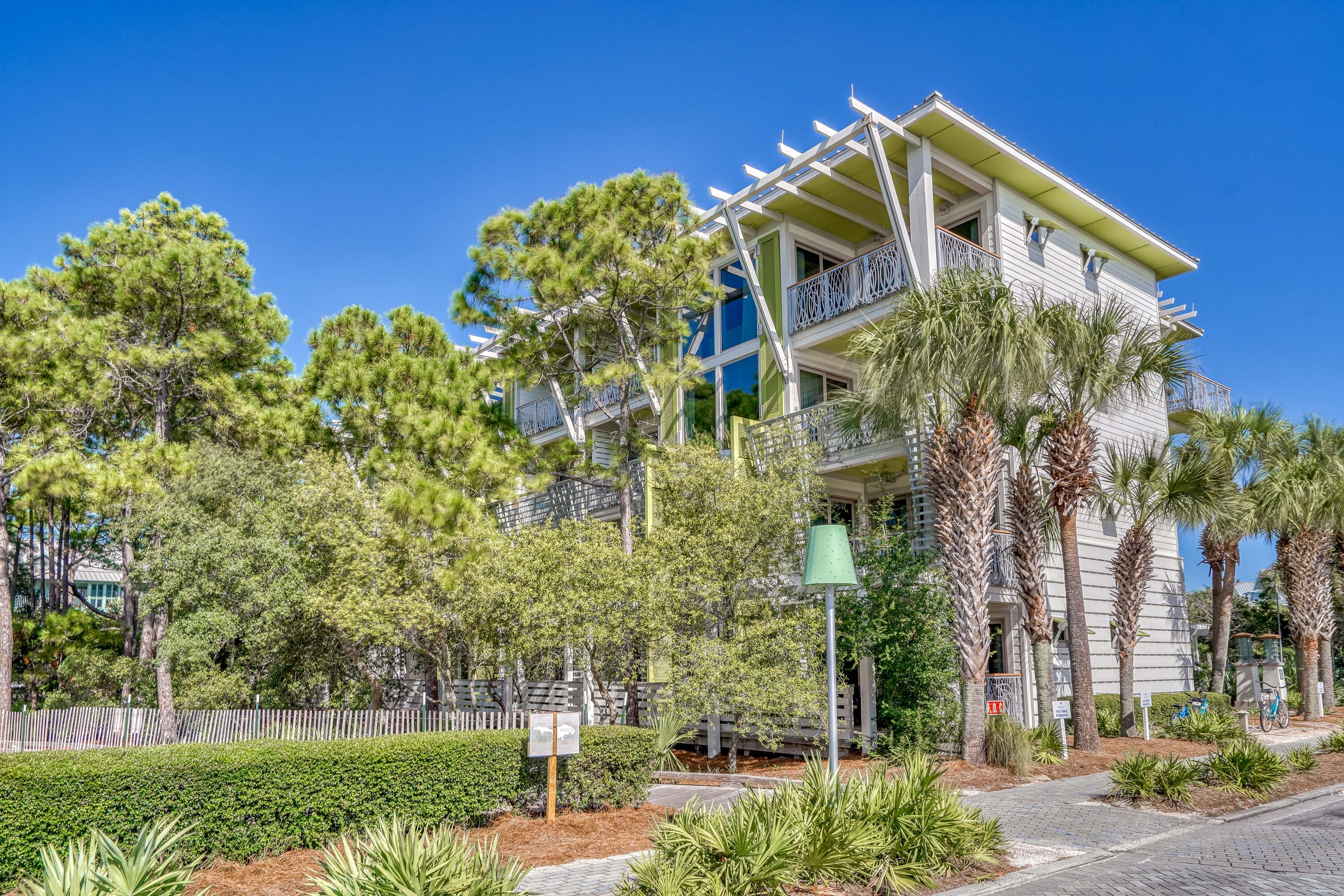 29 Goldenrod Circle, Unit 303/7 Santa Rosa Beach, FL 32459 - Photo 34 of 36 front view of a building with a garden