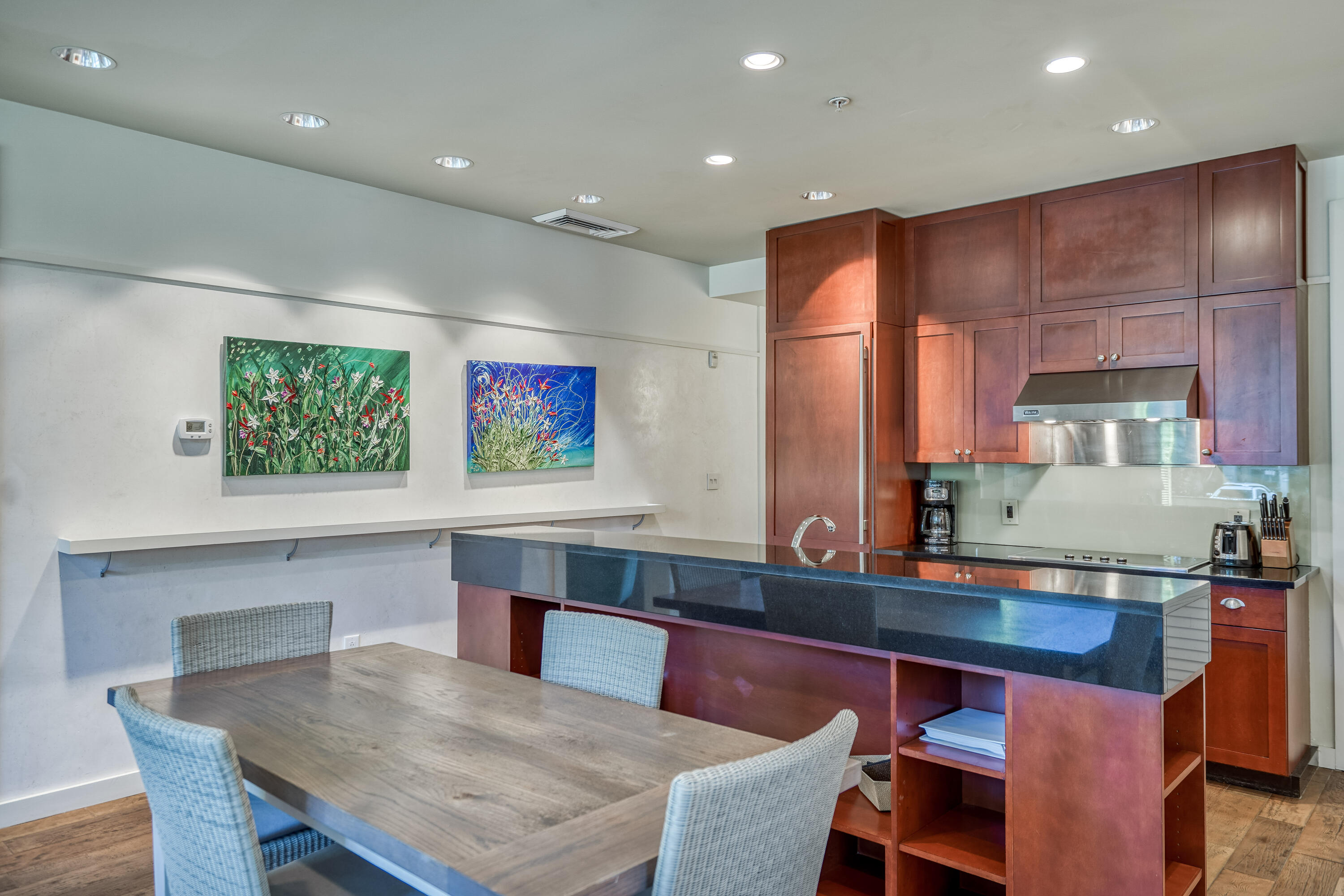 29 Goldenrod Circle, Unit 303/7 Santa Rosa Beach, FL 32459 - Photo 8 of 36 a kitchen with a table and chairs in it