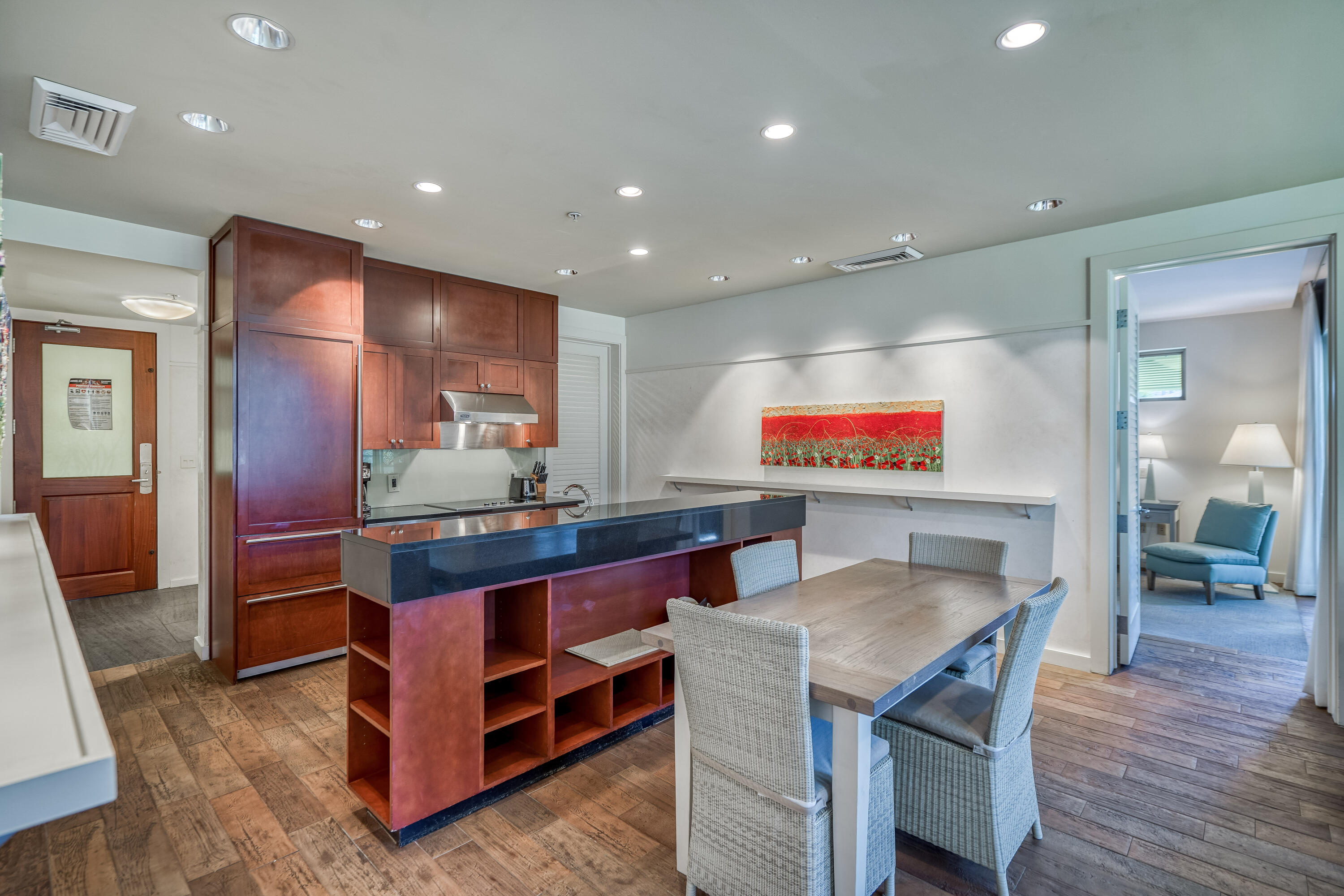 29 Goldenrod Circle, Unit 303/7 Santa Rosa Beach, FL 32459 - Photo 9 of 36 a kitchen with stainless steel appliances kitchen island granite countertop a table and chairs