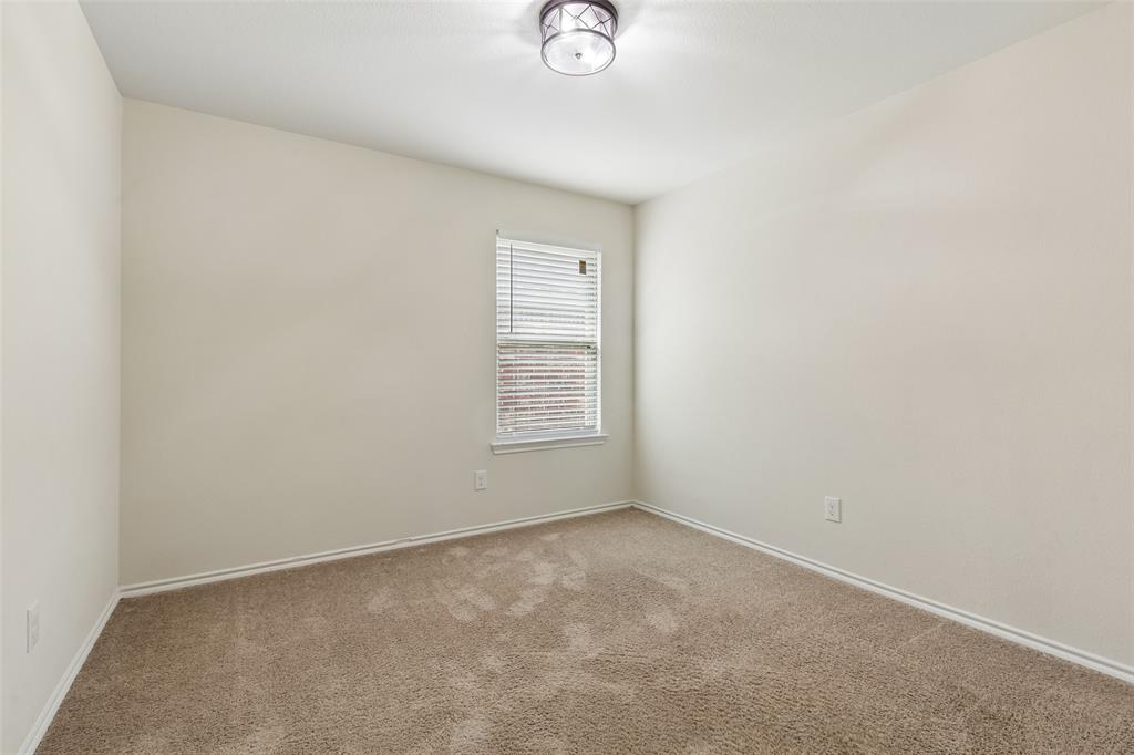 2850 Dusty Road Forney, TX 75126 - Photo 3 of 11 Carpeted room featuring neutral wall tones, a single window with horizontal blinds, and a flush-mount ceiling light fixture