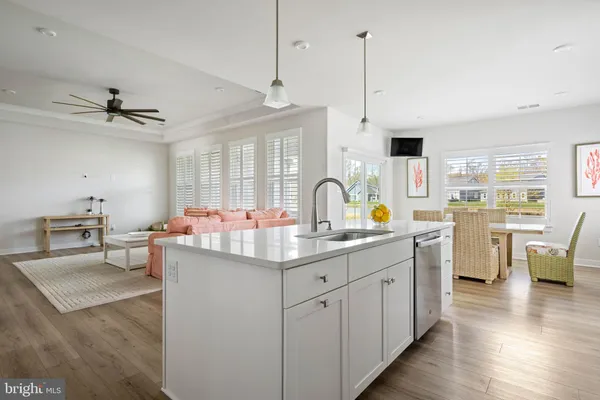 a kitchen with a sink appliances and cabinets