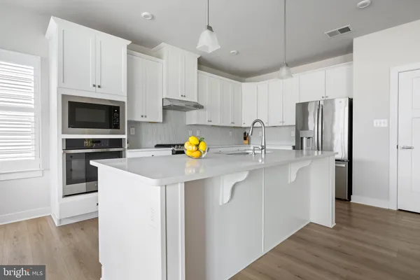 a kitchen with sink cabinets and window