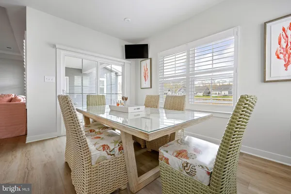 a large kitchen with a table and chairs