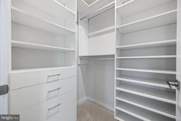 a view of an empty walk in closet