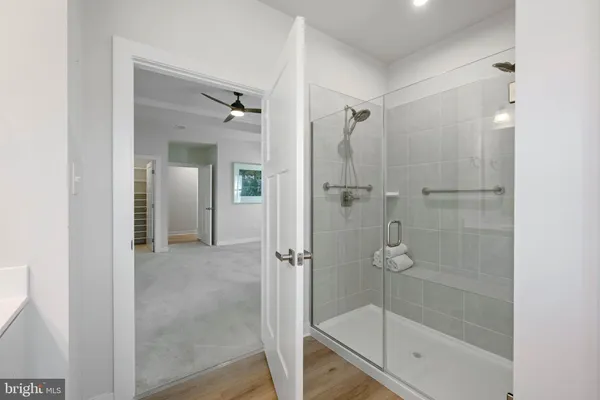 a bathroom with double sink and a window