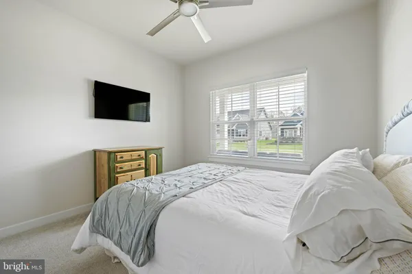 a bedroom with a bed and a table