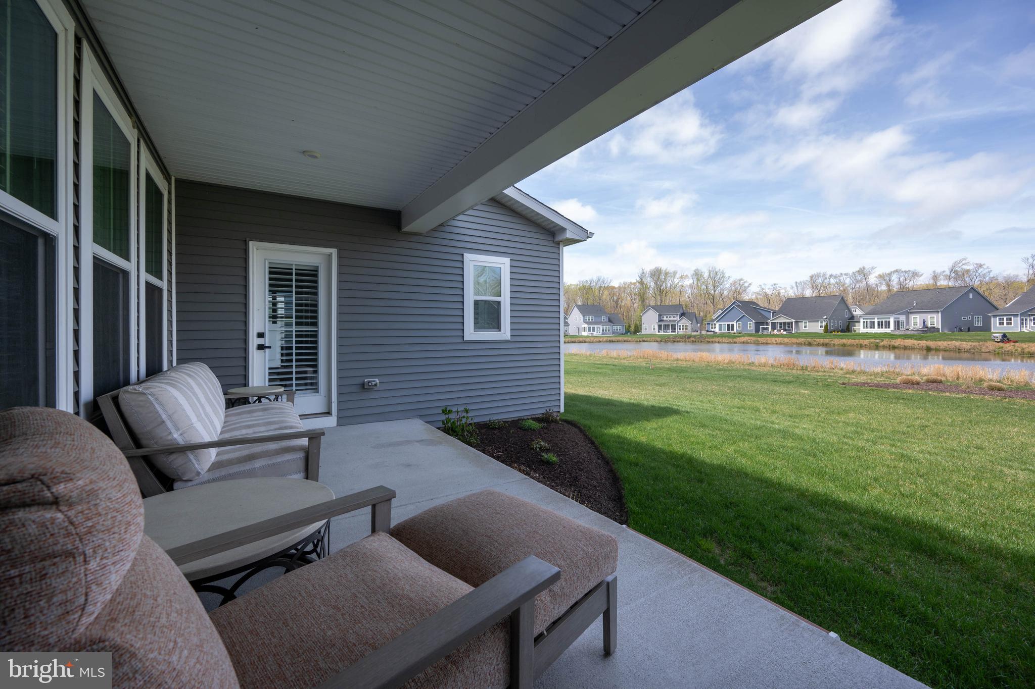 37689 Wildwood Lane Dagsboro, DE 19939 - Photo 36 of 43 Back porch off of kitchen overlooking pond