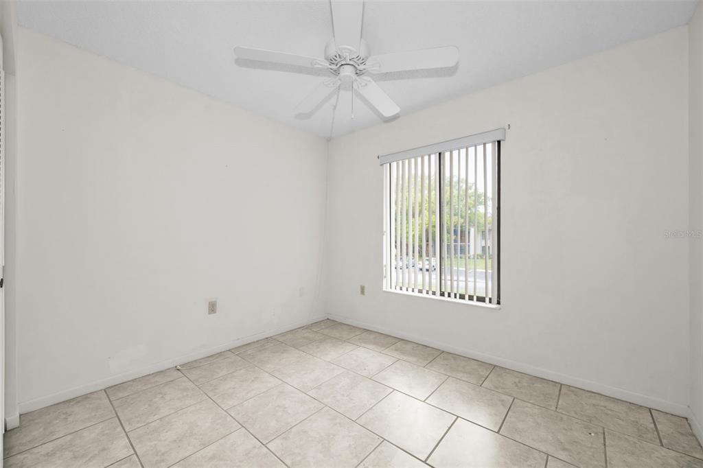 2687 Pine Ridge Way South, Unit B2 Palm Harbor, FL 34684 - Photo 25 of 68 a view of an empty room with a window
