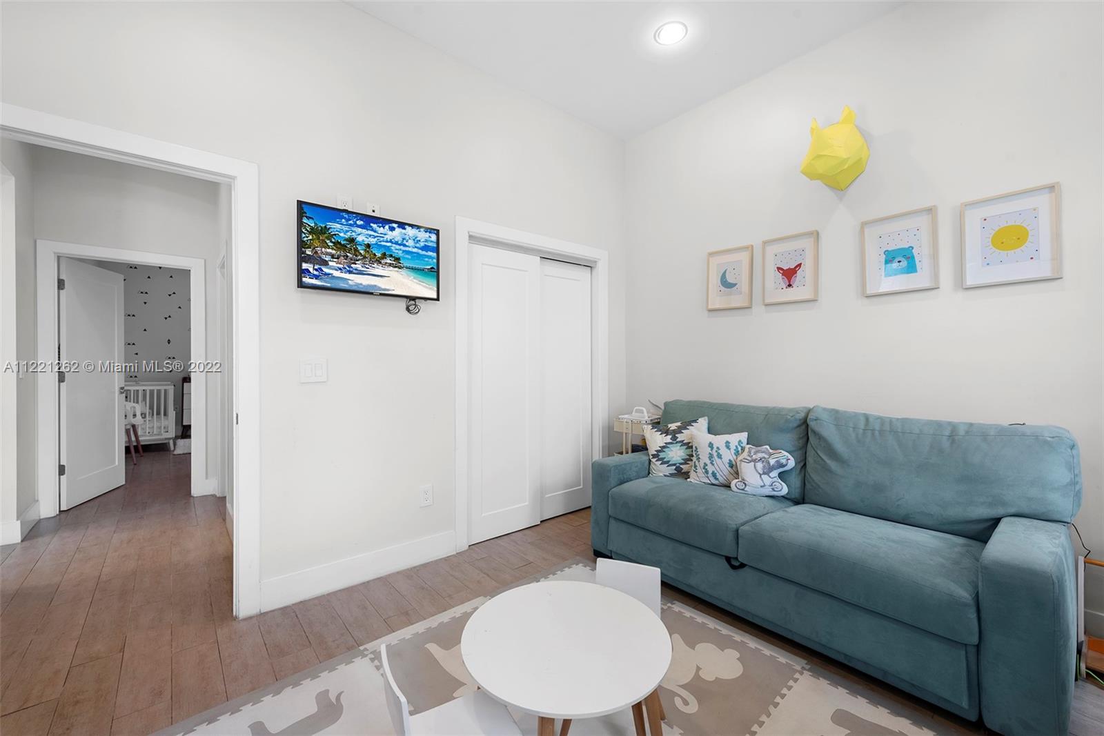 2321 Southwest 19th Street Miami, FL 33145 - Photo 18 of 29 a living room with furniture and a wooden floor